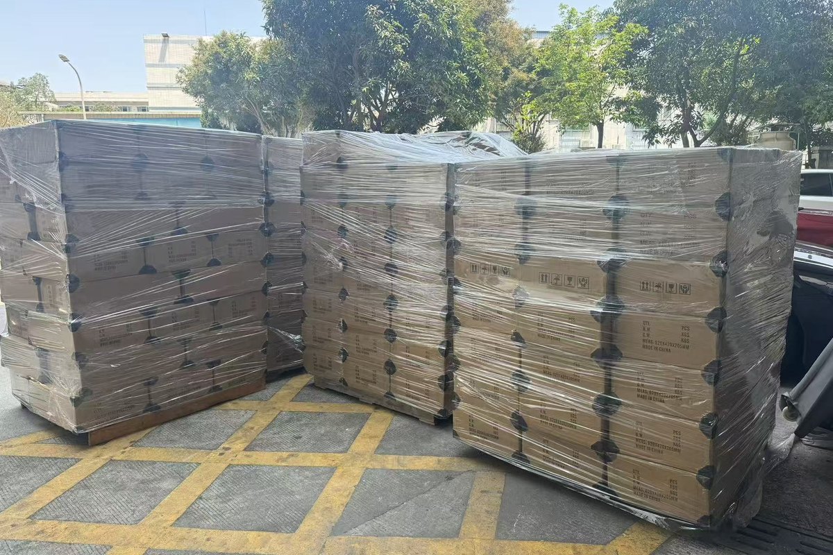 Shrink-wrapped export pallets staged on a loading dock